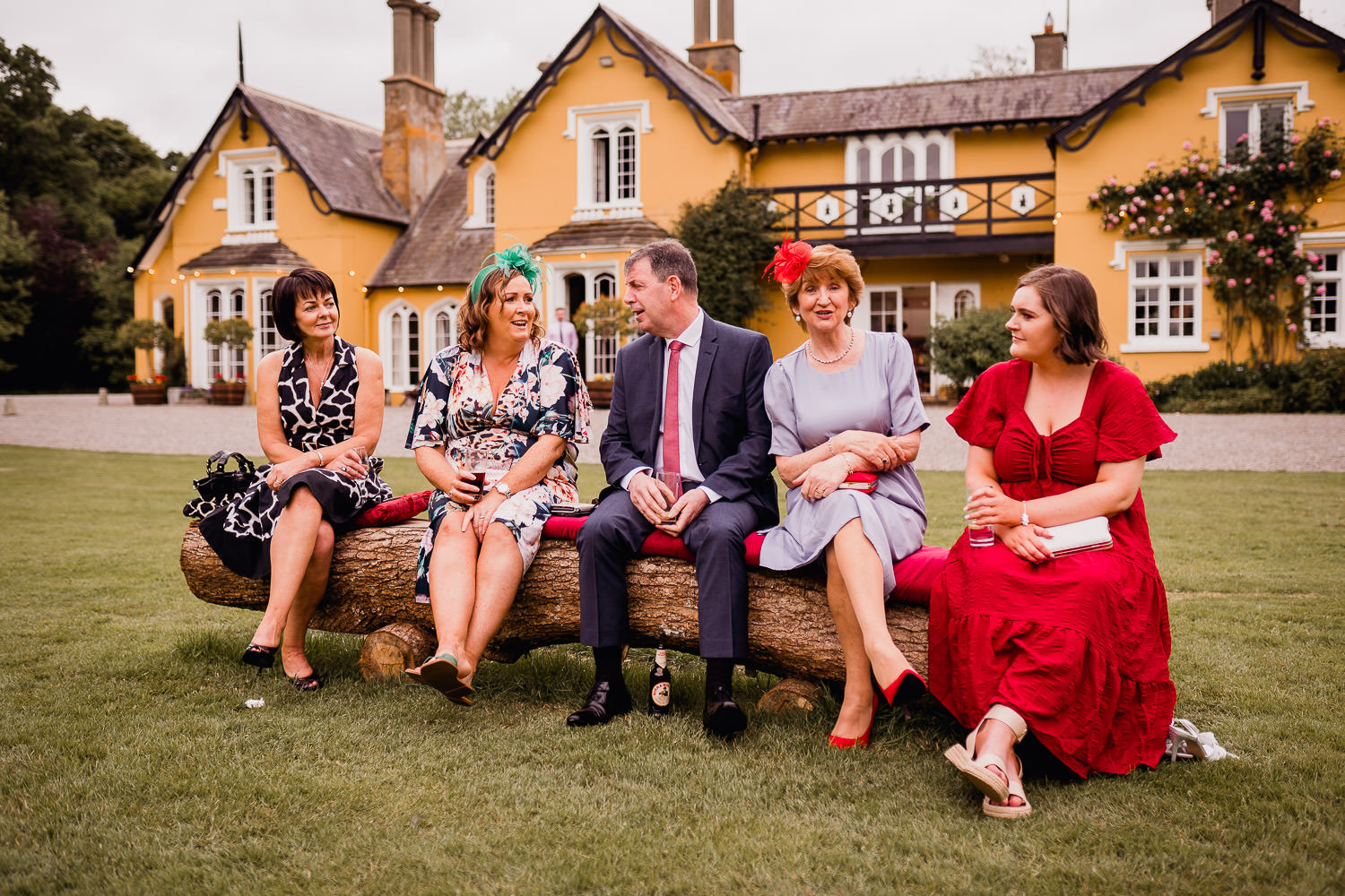wedding guests sitting in front of Martinstown House