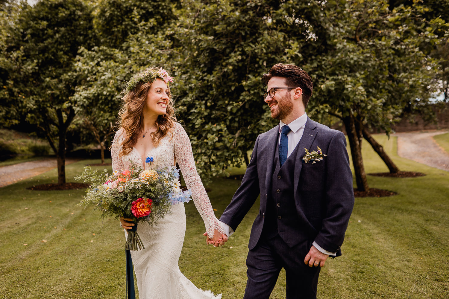 bride and groom walking in the gardens at Boyne Hill House