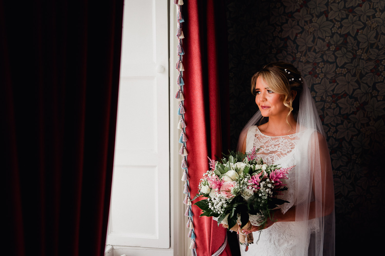 bride standing in window light at Boyne hill house