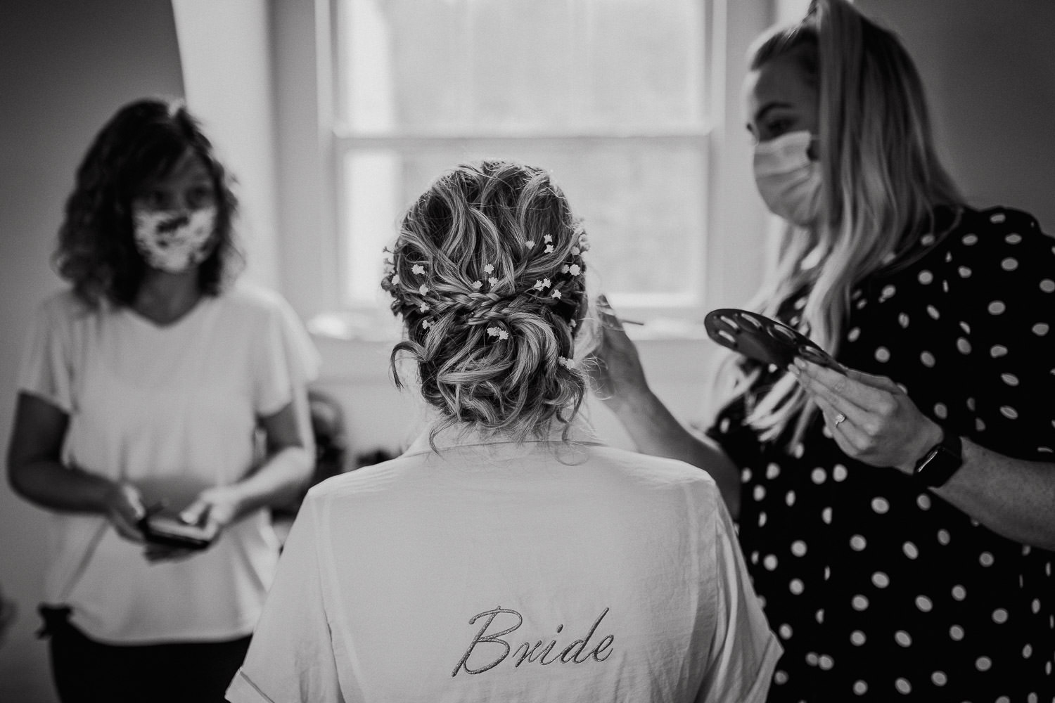 bride having her makeup done