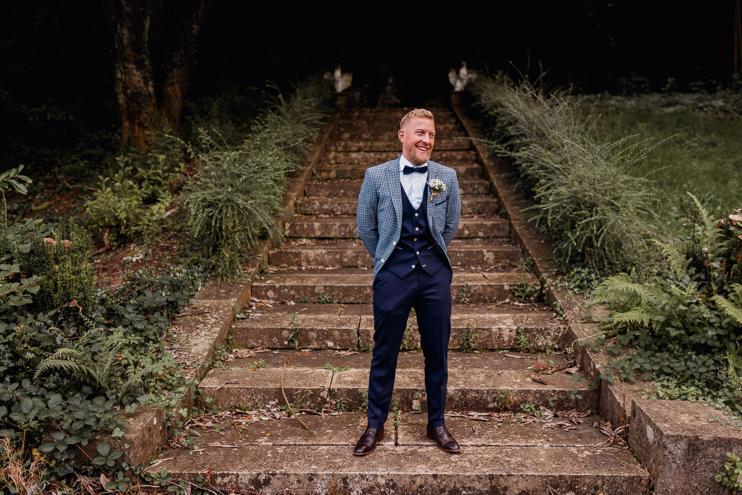 groom standing on the steps at Boyne Hill House