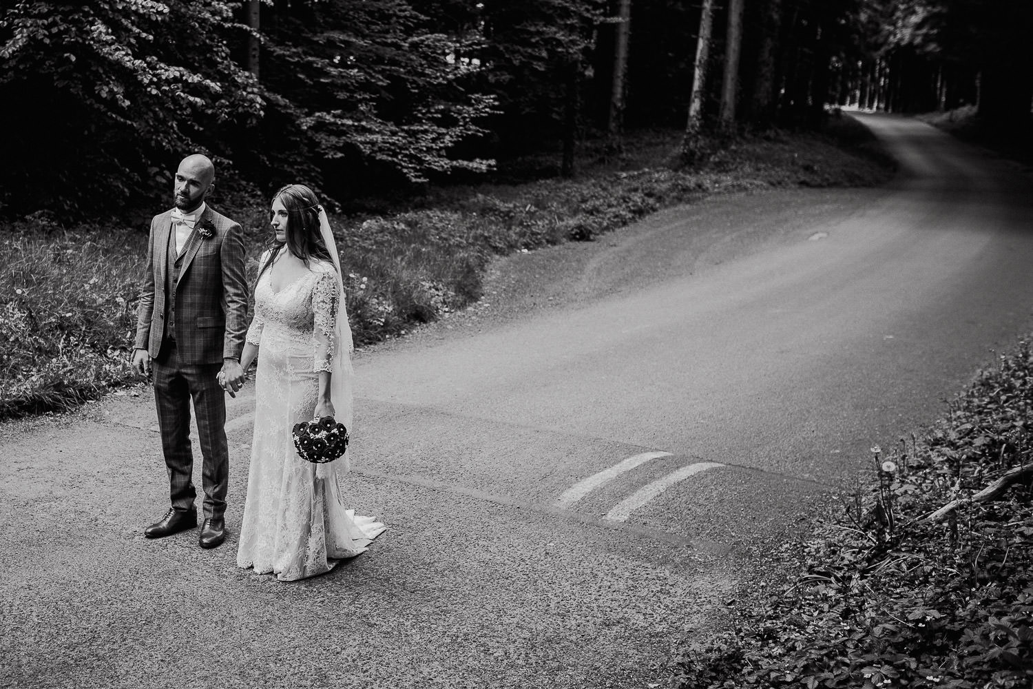 bride and groom walking down the driveway holding hands at Kinnitty castle