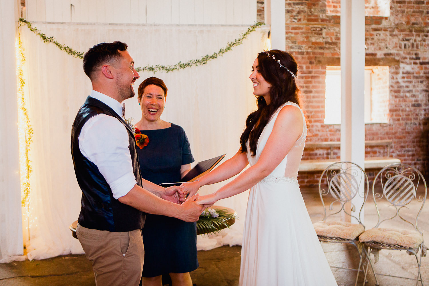 bride and groom exchanging vows during wedding ceremony