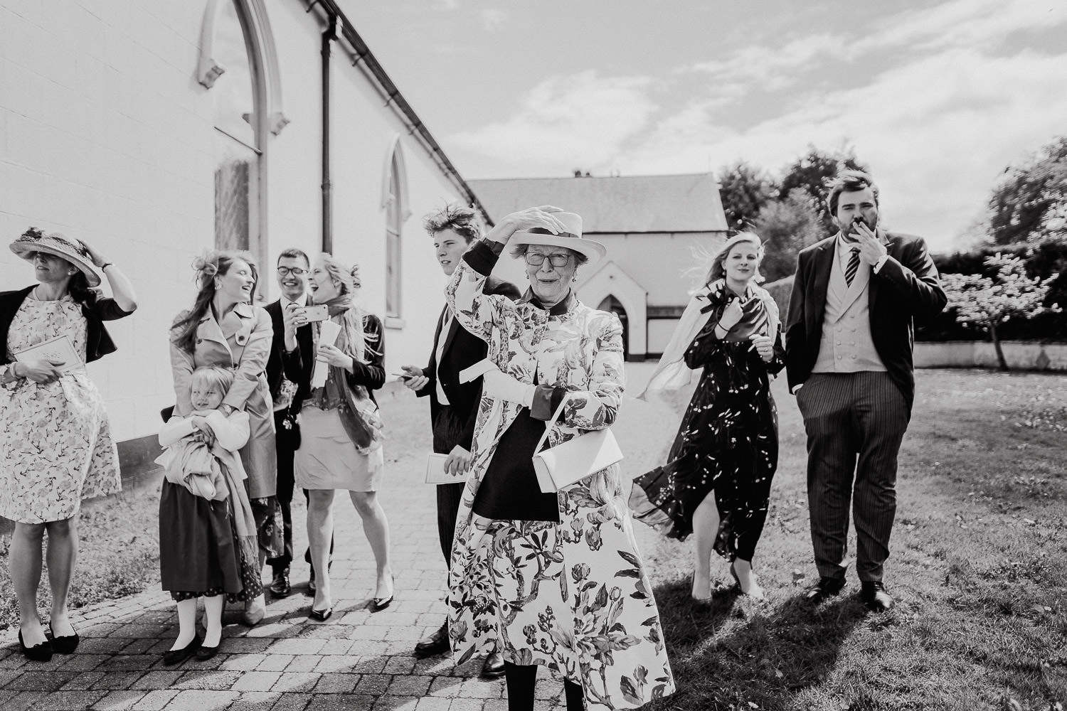 wedding guests waving