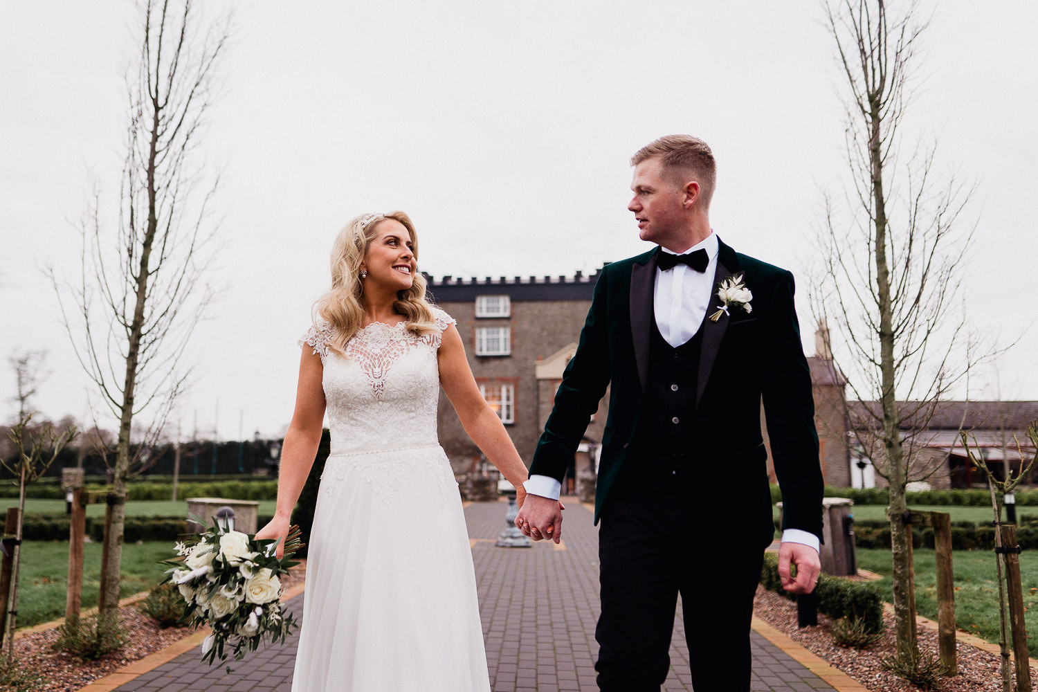 bride and groom holding hands at Darver Castle