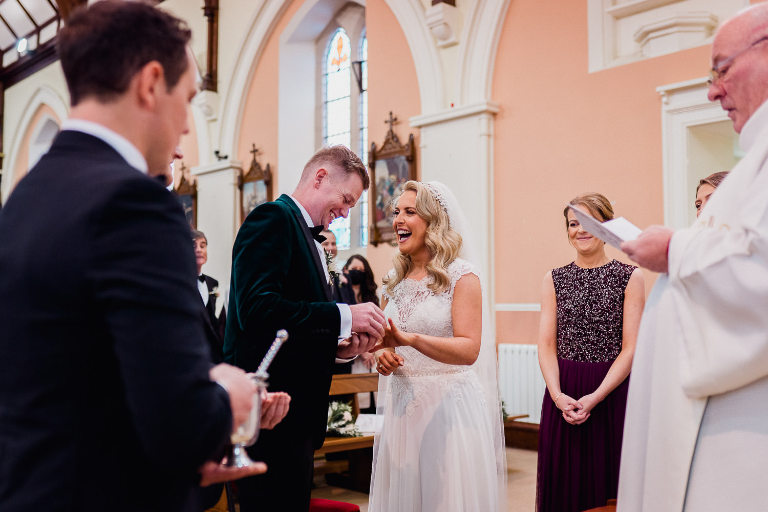 bride and groom exchanging vows during wedding ceremony