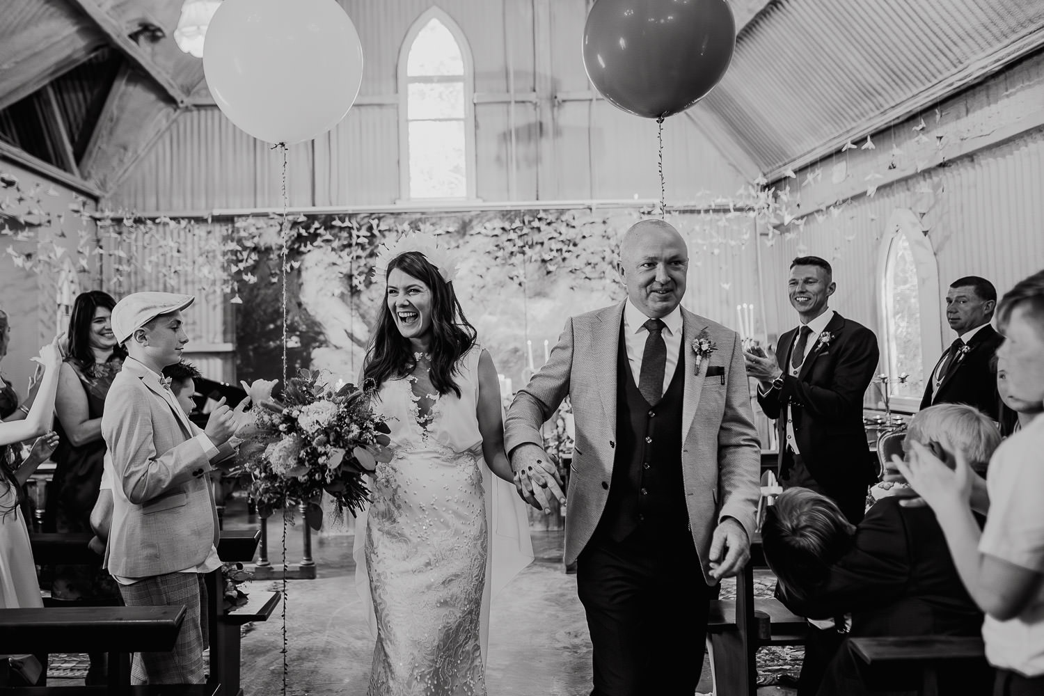 bride and groom holding hands during their wedding ceremony