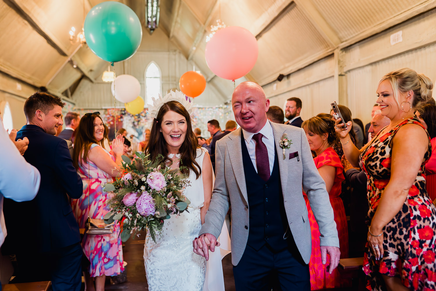 bride and groom holding hands during their wedding ceremony