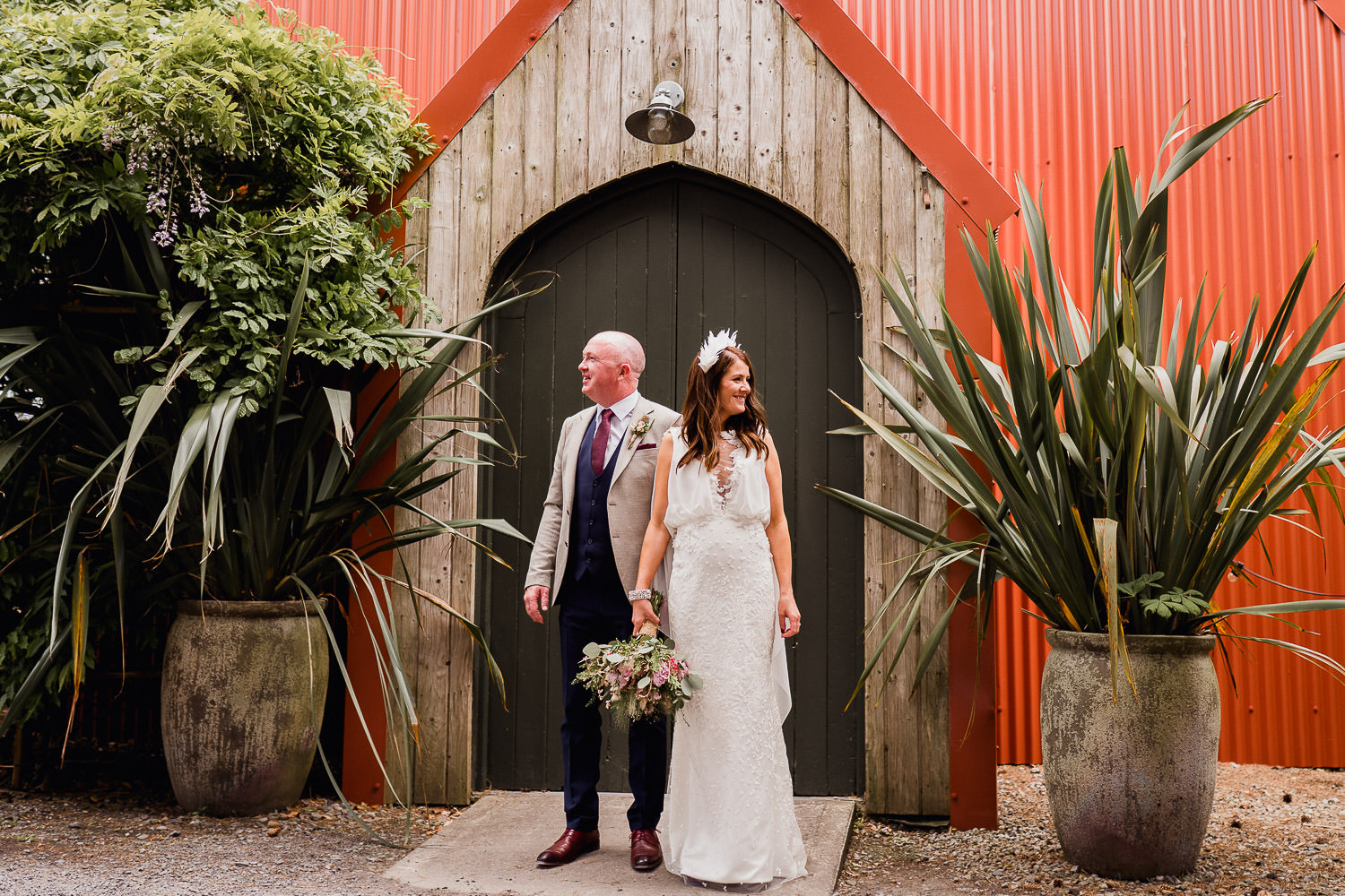 bride and groom holding hands outside the tin chapel at Mount Druid