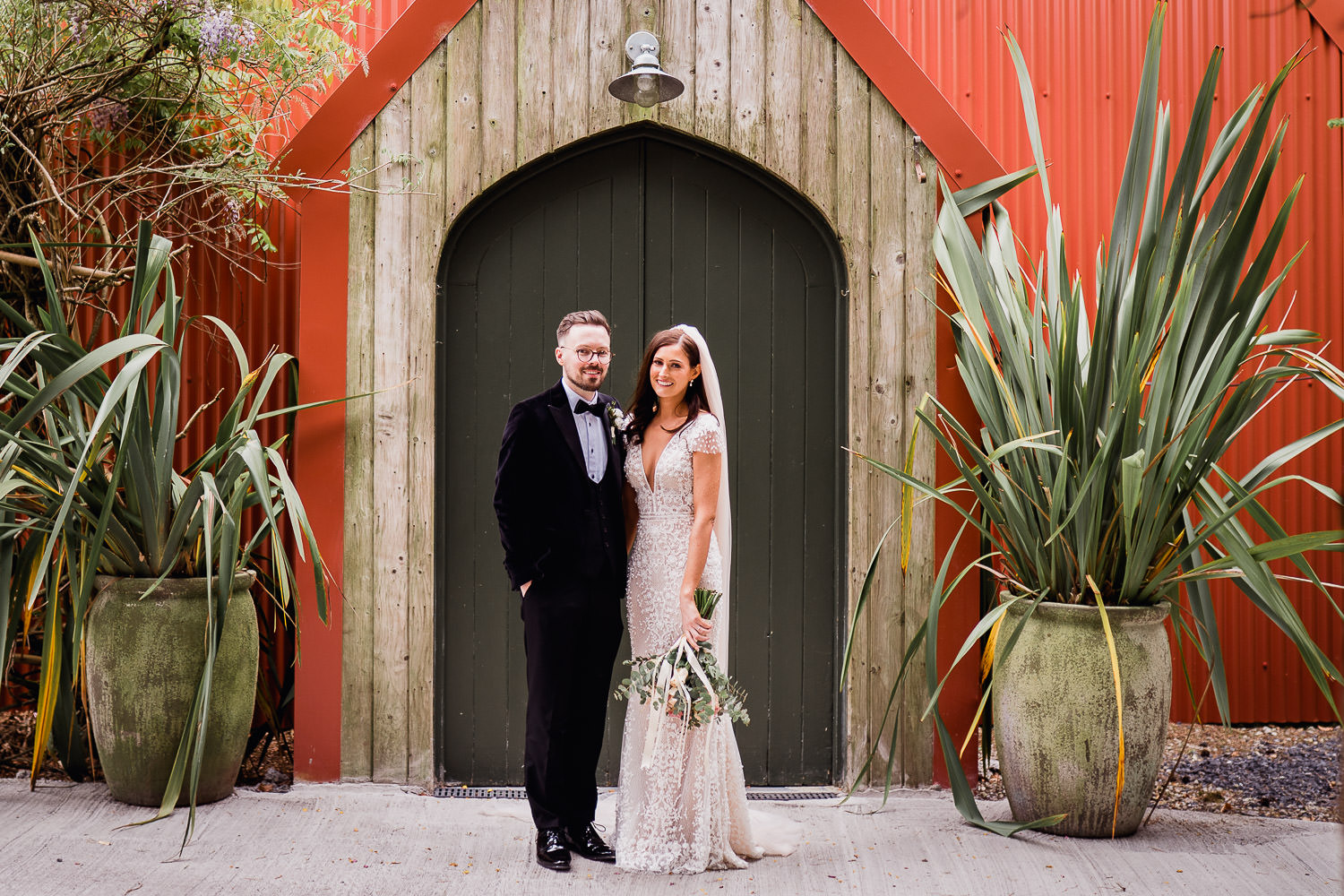bride and groom standing outside the tin chapel at Mount Druid
