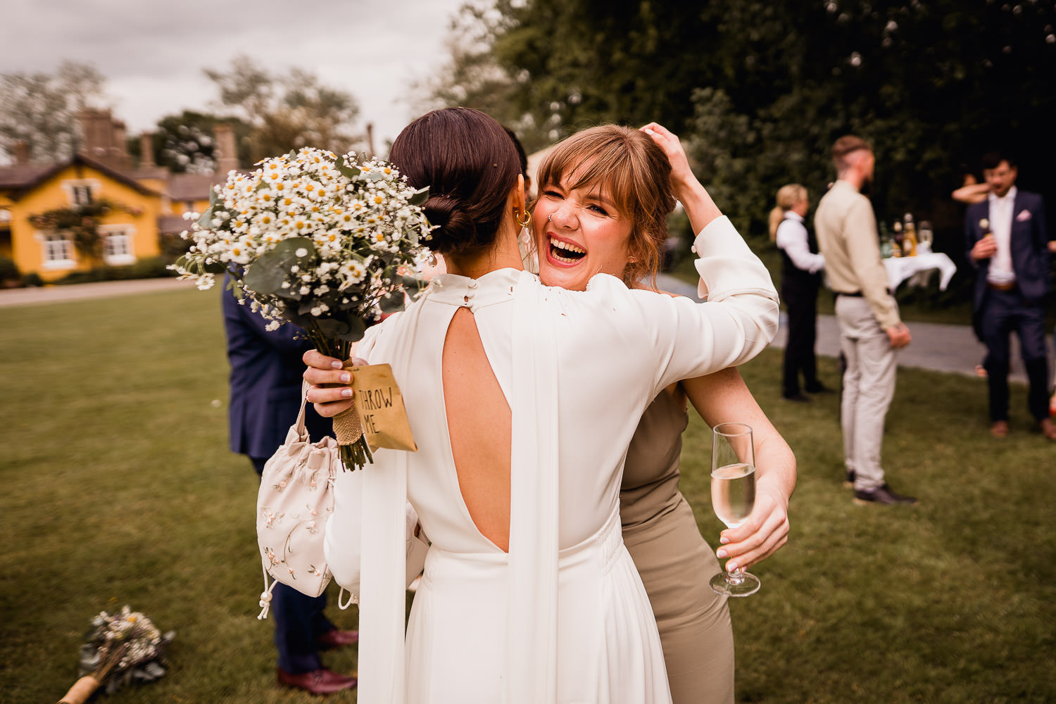 bride hugging her wedding guests