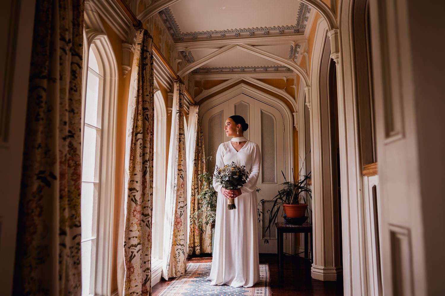bride standing in window light at Martinstown House